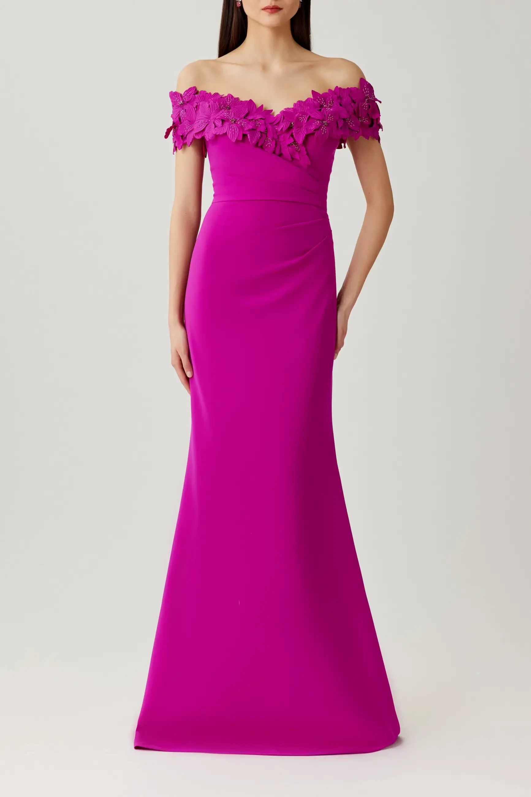 model is wearing a hot pink off the shoulder mothers dress