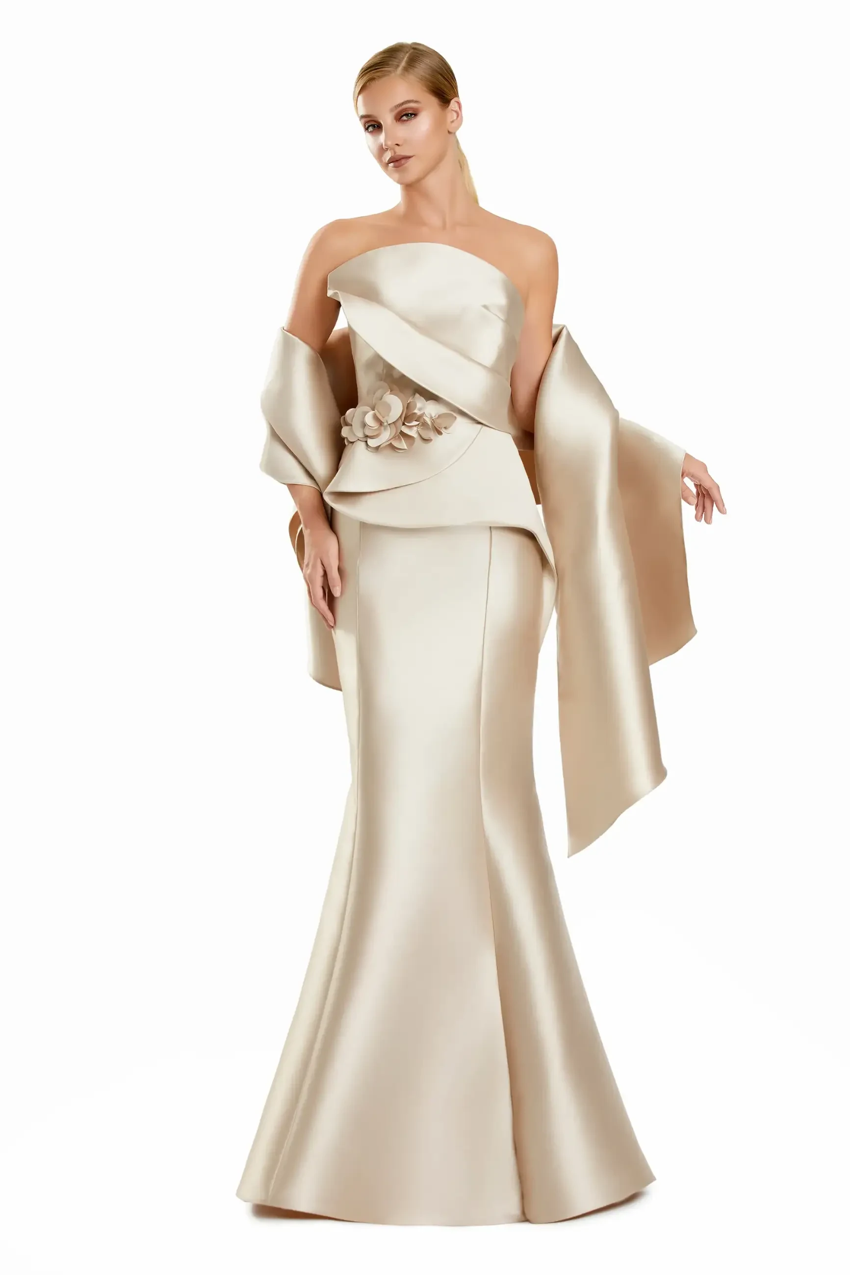 model is wearing a fit and flare champagne floor length gown with a matching shawl draped over the shoulders