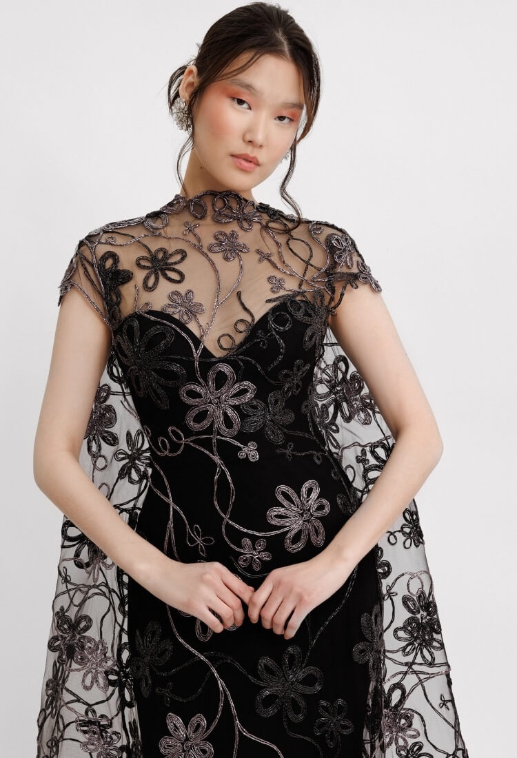 Model wearing a black dress