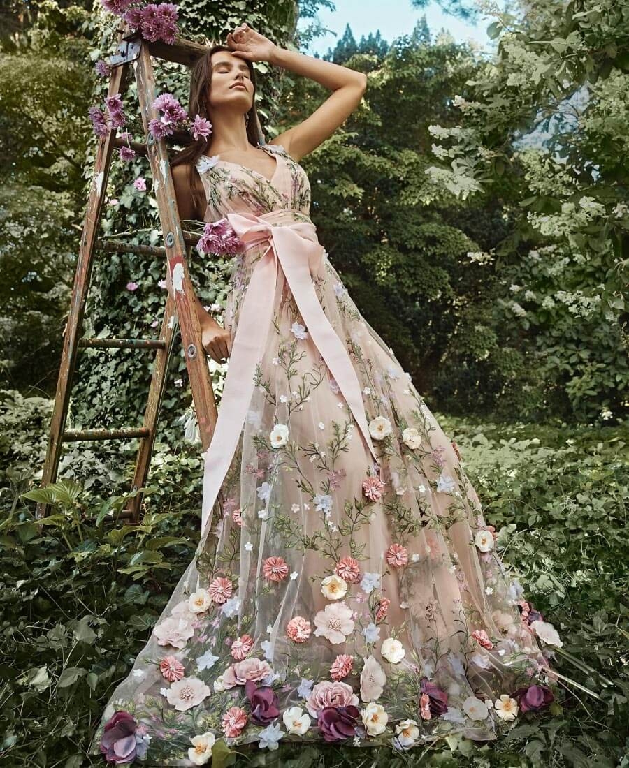 Model wearing a rose dress with flowers
