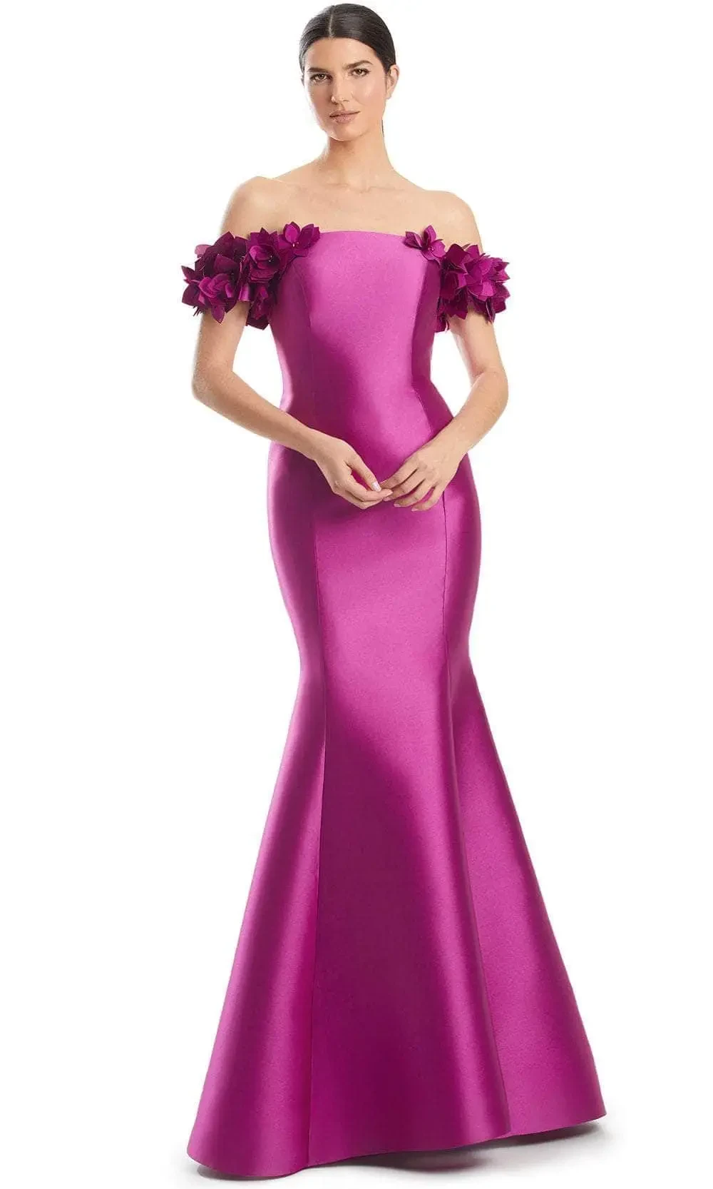 model is wearing a pink off the shoulder fit and flare evening gown